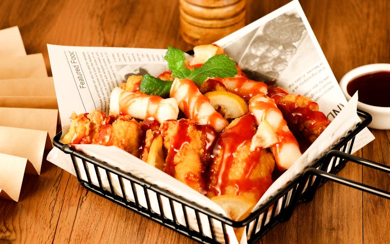 Franchise team members in matching Wing Snob uniforms